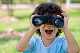 child-looking-through-binoculars